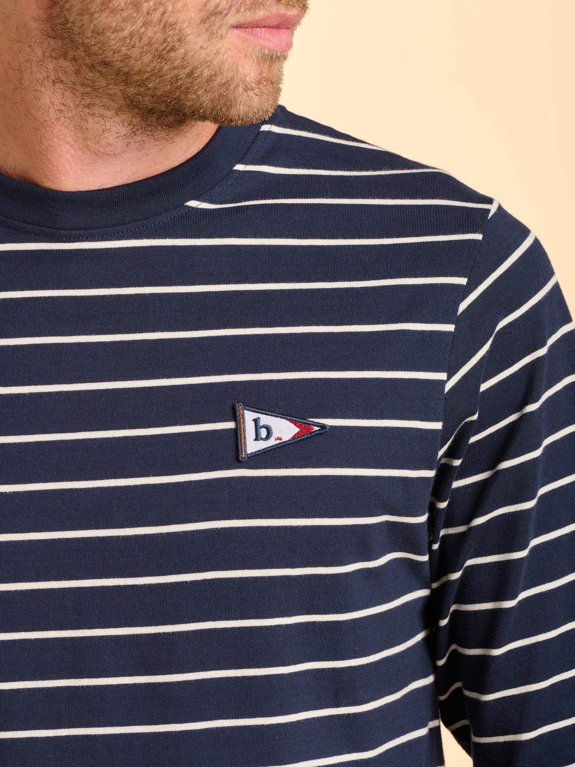 Navy and white striped long sleeve shirt with a Brakeburn logo embroidered on the chest.